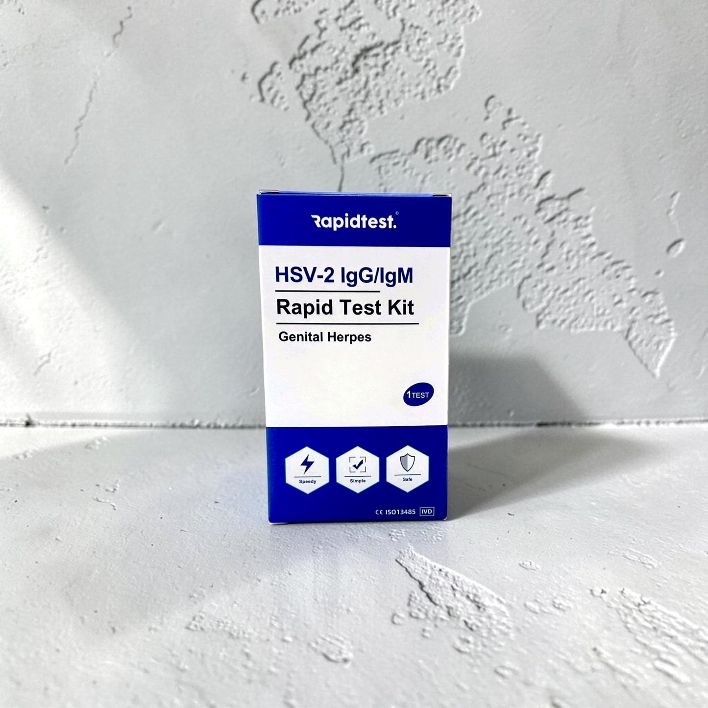 HSV-2 IgG/IgM Rapid Test Kit packaging on a white background. Test at home for genital herpes and get the results in 15 minutes - rapidtest.co