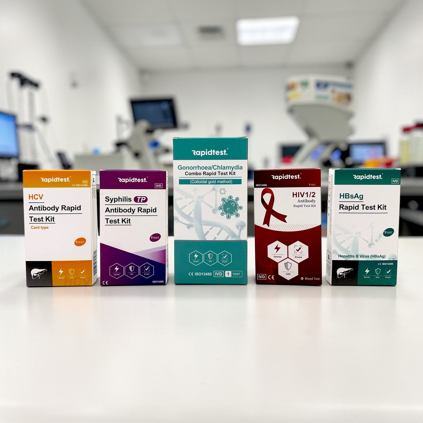 Collection of rapid test kit boxes in 6-in-1 STI bundle on a surface with a blurred medical setting in the background.