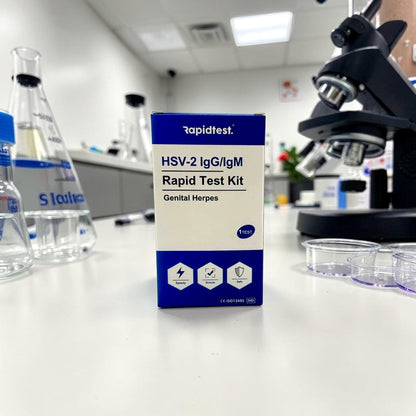HSV-2 IgG/IgM Rapid Test Kit on a laboratory counter with lab equipment in the background