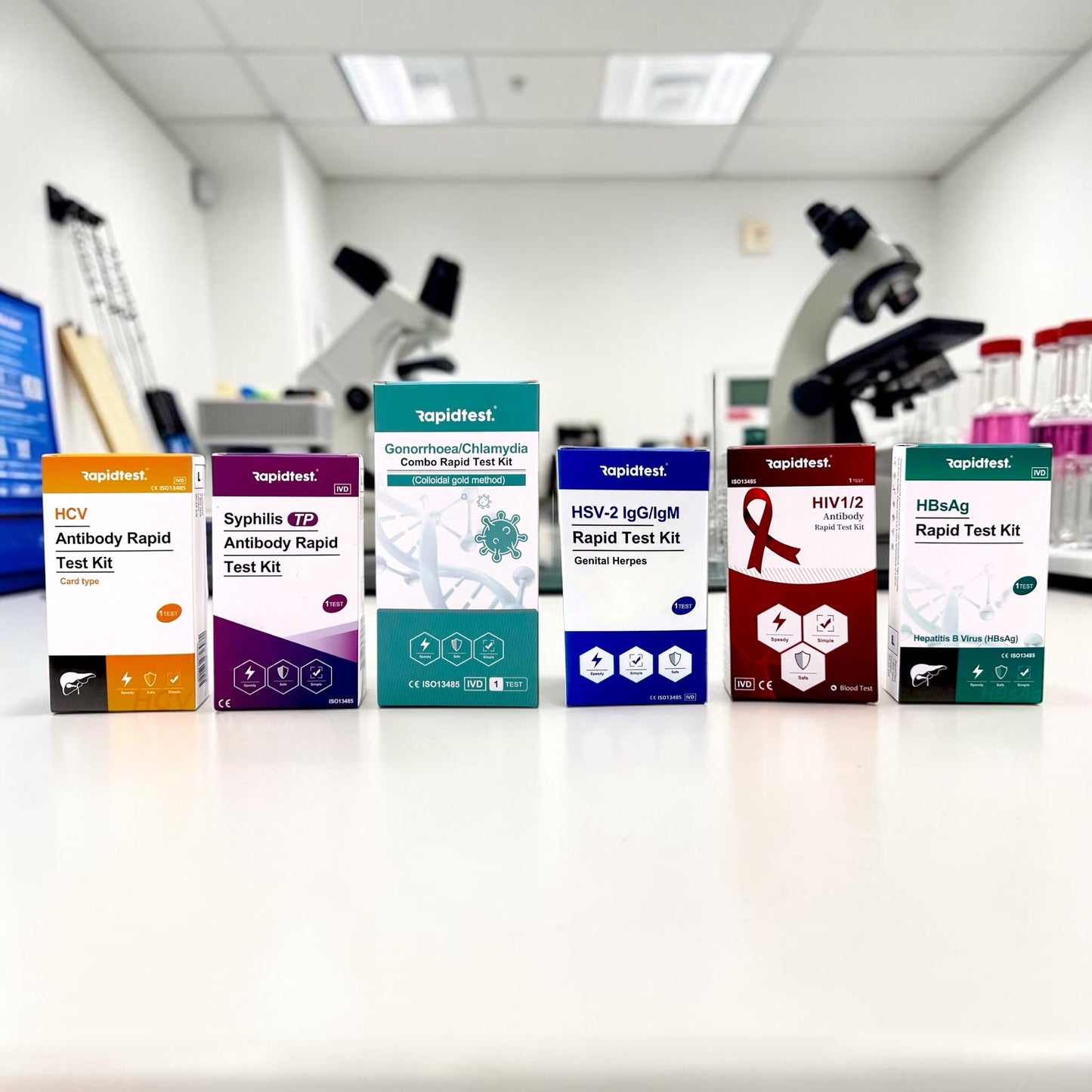 Collection of rapid test kit STI testing boxes in a laboratory setting with microscopes in the background.
