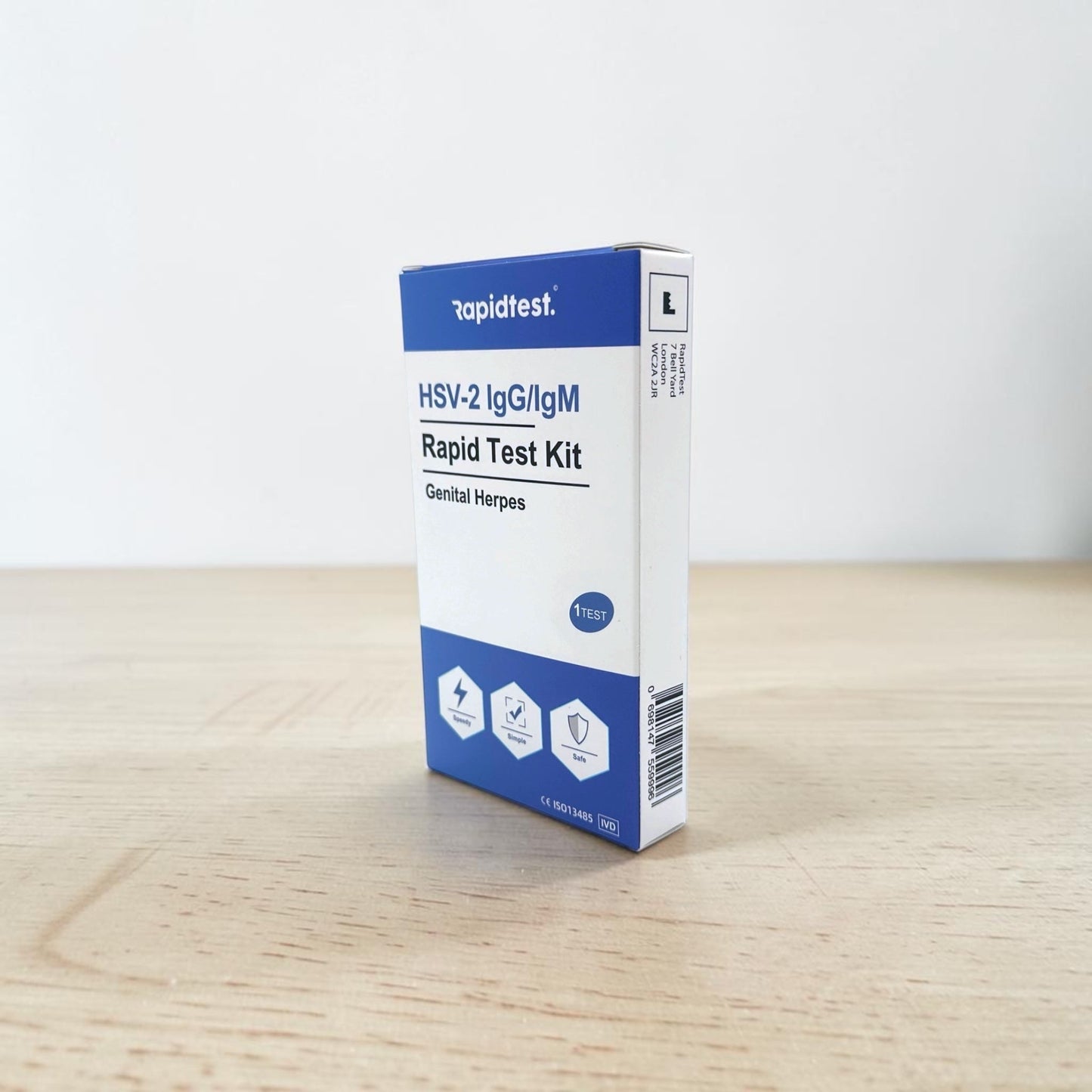 Rapidtest HSV-2 IgG/IgM Rapid Test Kit box on a wooden surface with a white background