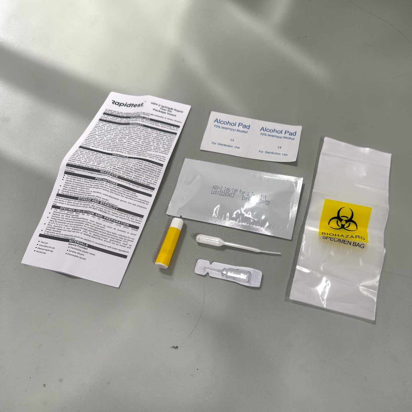 Collection of medical or diagnostic test items on a gray surface