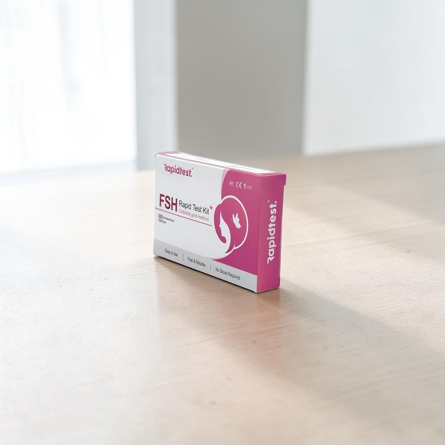 Rapidtest FSH test kit package on a wooden surface - rapidtest.co