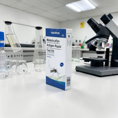 Malaria test kit box on a laboratory counter with a microscope in the background - STIhealthcheck.com